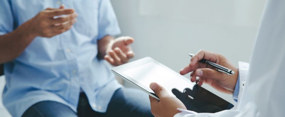 A doctor talking to a patient